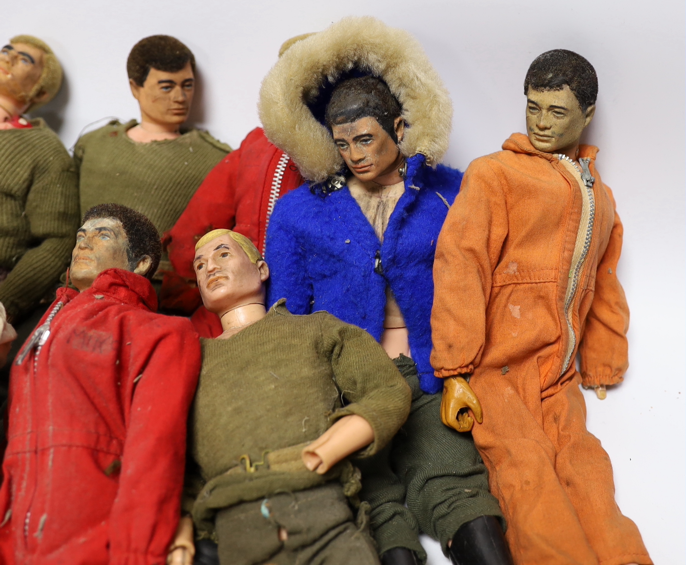 Nine 1960s/70s Action Man figures together with clothes and some accessories (a.f.)